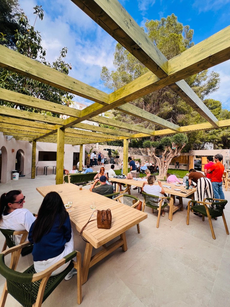 Guests on the terrace under the pergola